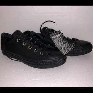 Black leather converse.
